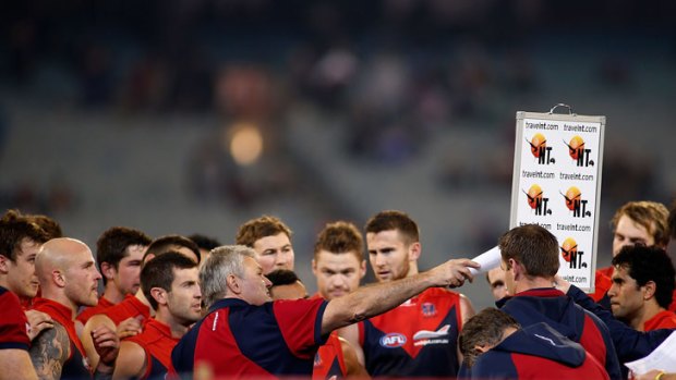 Caretaker coach Neil Craig instructs Melbourne players during their win over the Western Bulldogs.