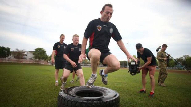 Gruelling: Opposition Leader Tony Abbott is put through his paces by troops from the 1st Armoured Regiment at Robertson Barracks in Darwin on Friday.