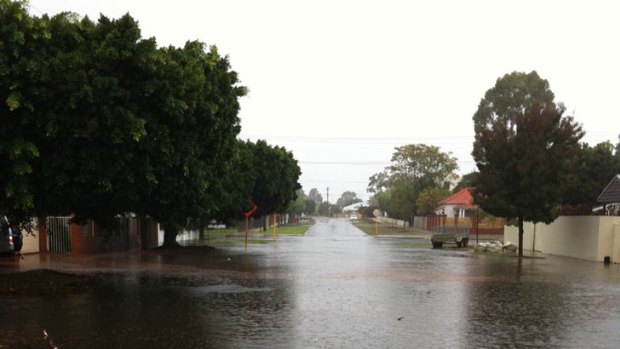 A North Perth street is submerged by water after the heavy storms passed through the city.