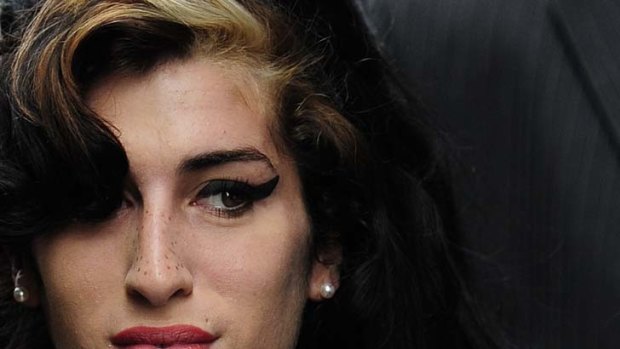 British singer Amy Winehouse arrives at Westminster Magistrates Court in central London in this July 23, 2009 file photo. Winehouse has been found dead at her home in north London, Sky News reported on July 23, 2011.  REUTERS/Toby Melville/Files (BRITAIN - Tags: ENTERTAINMENT OBITUARY)