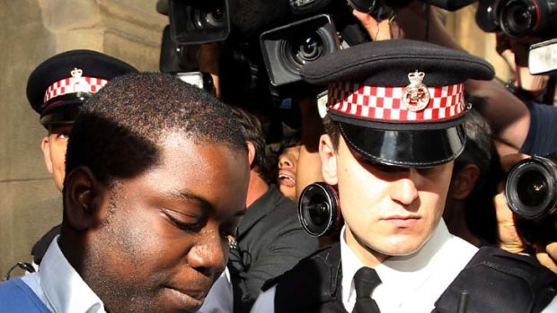 Financial focus ... Kweku Adoboli is led from court after hearing claims he falsified records at UBS.