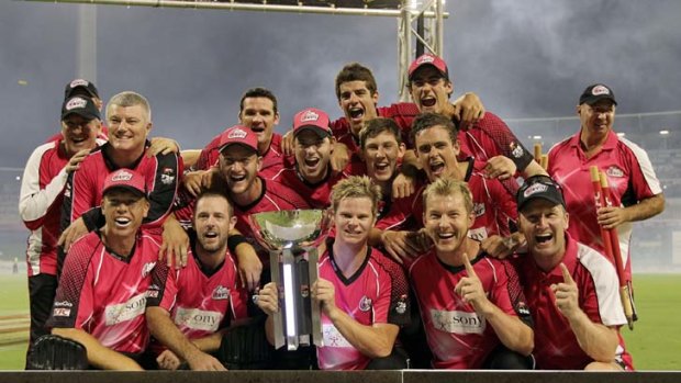 Captain Steve Smith holds the trophy after the Sixers beat Perth in the final.