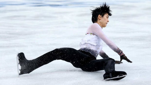 Yuzuru Hanyu of Japan falls before winning gold at Sochi.