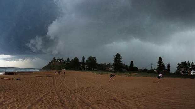 A storm causes mayhem: Storm clouds bear down on Newport beach.
