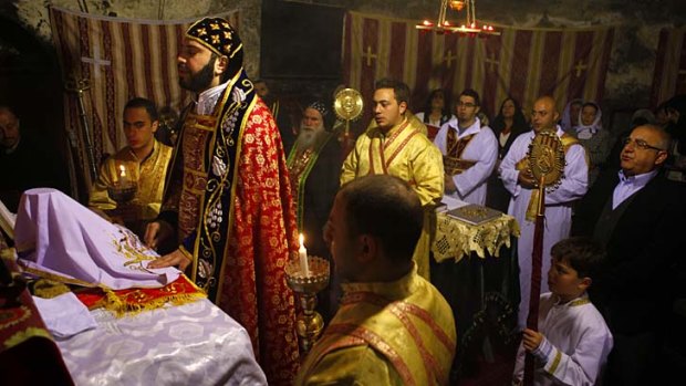 Holy place: The Syriac Orthodox community attend a mass during Lent in Jerusalem's Church of the Holy Sepulchre.