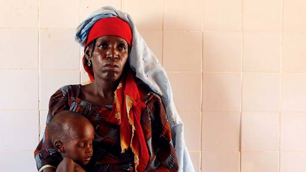 The brink ... Mariama Awa, 25, and son Malla at a stabilisation centre.