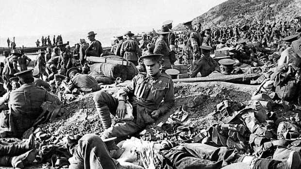 Carnage: An Australian soldier lies wounded as his comrades search for the dead and injured on the day of the Gallipoli landing.