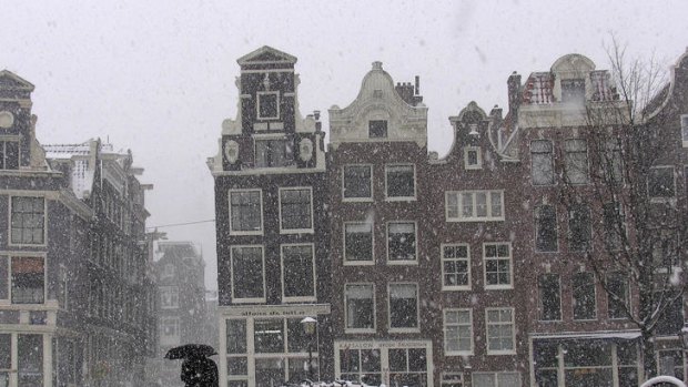 Amsterdam is blanketed in snow.