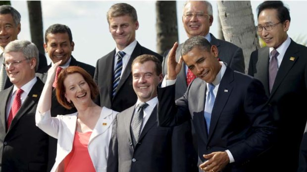 US President Barack Obama mimics Australian Prime Minister Julia Gillard by joking about the need to groom his hair.