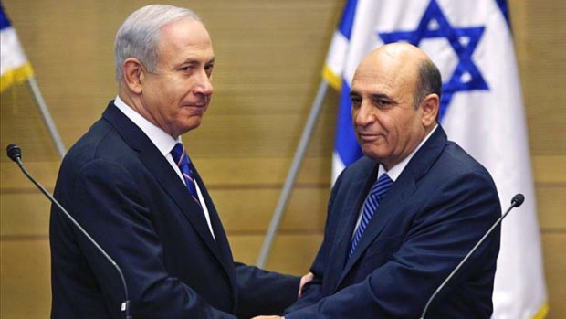 Israel's Prime Minister Benjamin Netanyahu, left, and Kadima party leader Shaul Mofaz announce the new coalition.