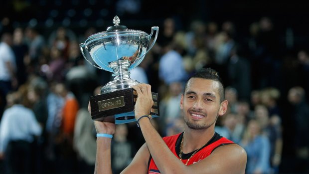 Winner: Nick Kyrgios holds his trophy after beating Marin Cilic.