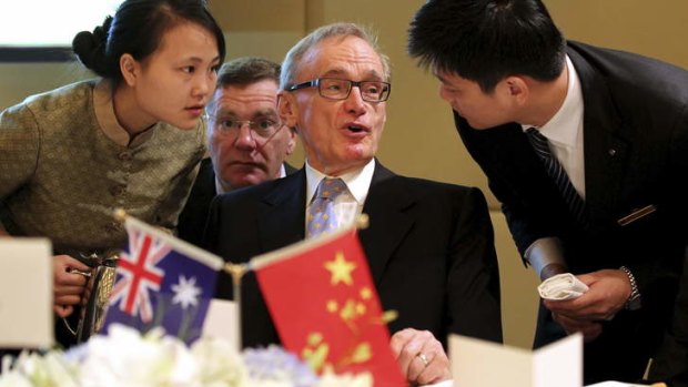 Bob Carr deals with the fine print in Chengdu.