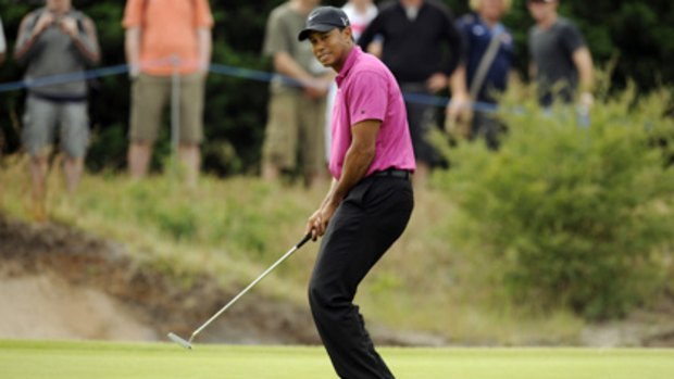 Tiger Woods agonises over a missed putt on the 17th.