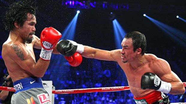 Manny Pacquiao and Juan Manuel Marquez battle it out during their welterweight fight on Saturday.