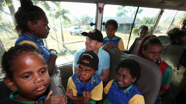 Prime Minister Tony Abbott joins the Remote School Attendance Strategy bus to pick up school children for school in Bamaga, during his visit to Cape York, in August 2015. 