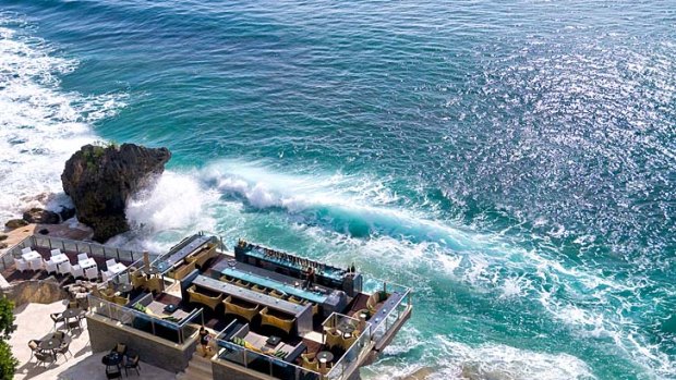 Rock Bar at the Ayana Resort and Spa. The minimalist design of this bar makes perfect use of the rocks on which it sits, just metres above the ocean at the base of towering cliffs.