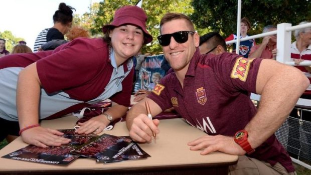 Brent Tate poses for a photo with a fan earlier in the week.