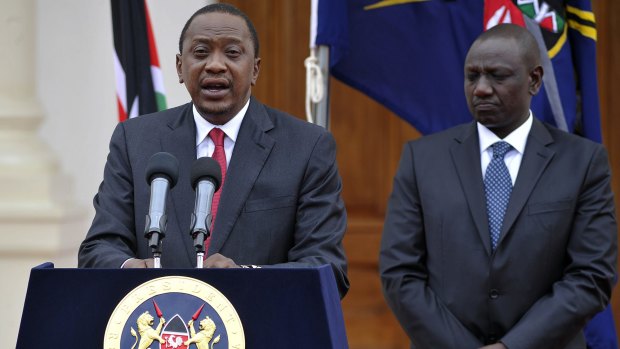 Declaring war on Al Shabaab Islamists ... Kenyan President Uhuru Kenyatta delivers his state of the nation speech next to Vice President William Ruto (right) at the State House in Nairobi.