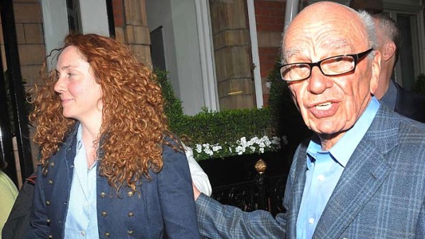 Rupert Murdoch, pictured outside his London home with Rebekah Brooks.