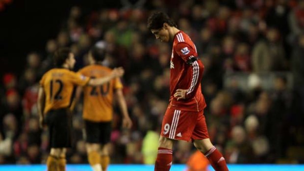 Dejected ... Fernando Torres of Liverpool walks off at the end of the match.