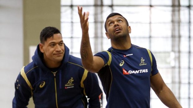 Still at 10 ... Kurtley Beale, right, at training with Israel Folau.