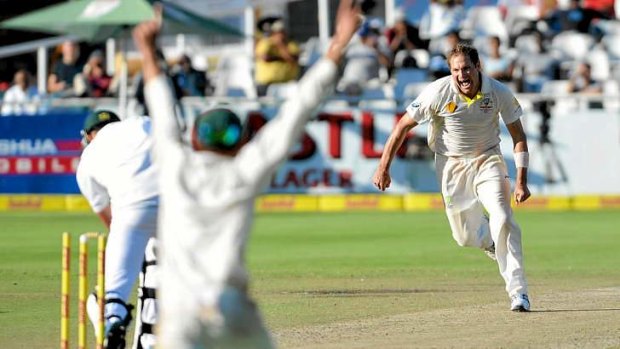 The best of times: Ryan Harris takes the last wicket to secure the third Test against South Africa.
