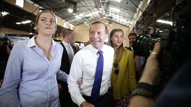 Tony Abbott and his daughters, Bridget and Frances, in Brisbane on the campaign trail last year.