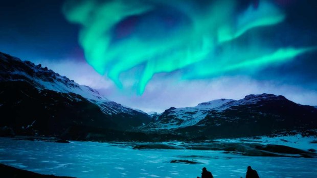 Aurora: Hikers under Northern Lights in Iceland. Did you know the word aurora comes from the Latin, meaning dawn or goddess of the dawn? Seems more than fair. 