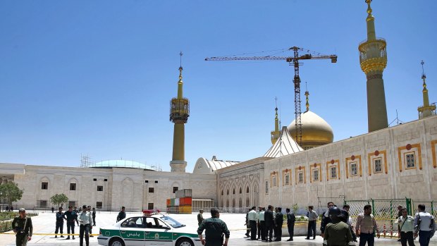 Police officers control the scene, around of shrine of late Iranian revolutionary founder Ayatollah Khomeini, after an assault by several attackers in Tehran.