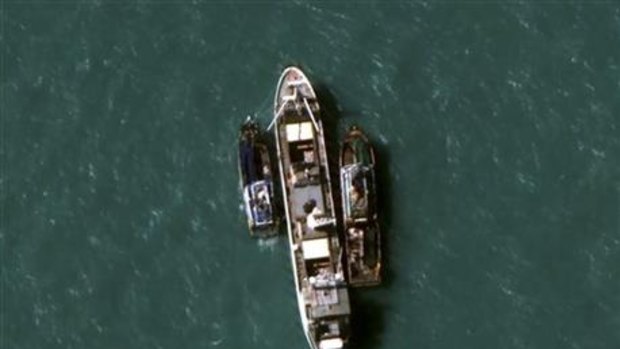 A satellite image by DigitalGlobe showing two fishing trawlers beside the cargo ship Silver Sea 2 in July. 