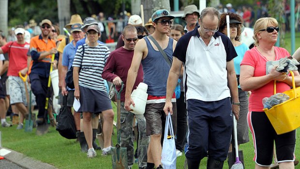 People queue to help flood victims after Brisbane was inundated in January.
