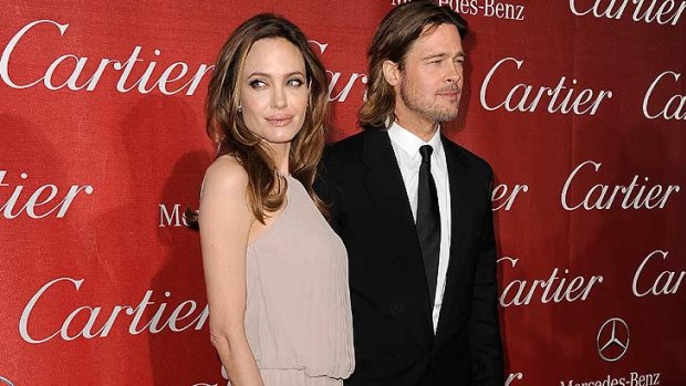Angelina Jolie and Brad Pitt ... Pitt was supported by a cane on the red carpet, as he had injured his knee in a skiing accident.