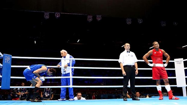 Disgusted ... Ali Mazaheri leaves the ring after the controversial decision.