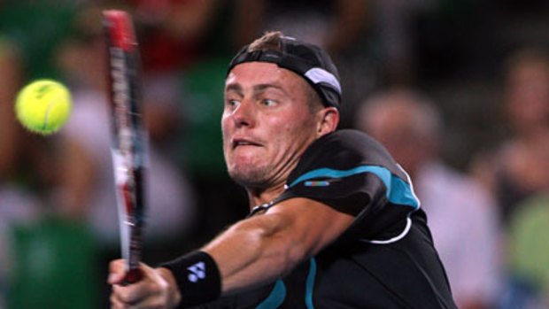 Back in black ... Lleyton Hewitt cruised to a straight-sets victory in his opening singles match on day one of the Hopman Cup in Perth.