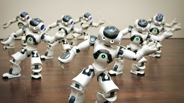 A group of programmable humanoid Nao robots, developed by a French company Aldebaran Robotics, perform dance inside the France Pavilion at the Shanghai Expo in China Friday, June 18, 2010. (AP Photo)