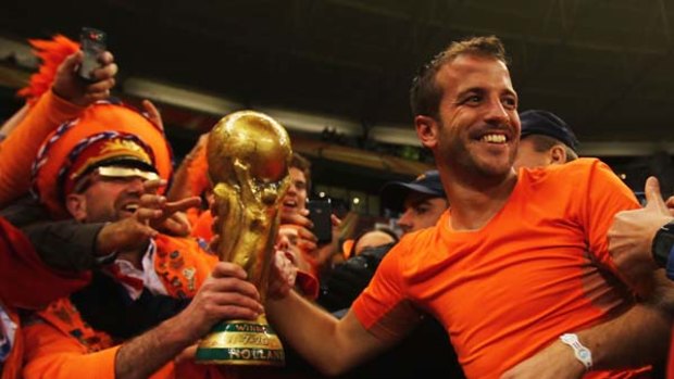 Netherlands fans celebrate victory and a place in the final with Rafael Van der Vaart.