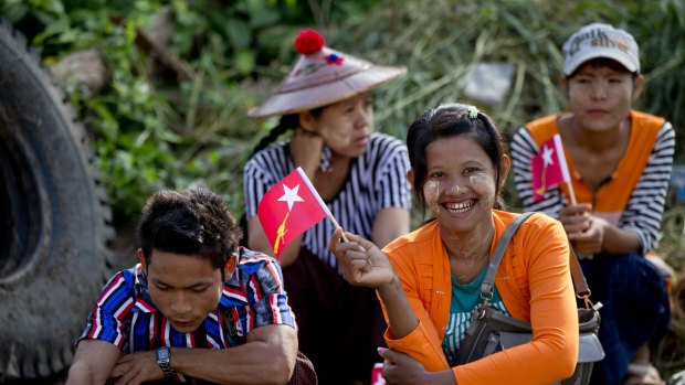 Supporters of Myanmar's opposition leader Aung San Suu Kyi await to welcome her at a rally on Friday.