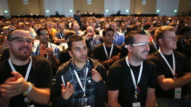 Attendees, some wearing Google Glass, watch a keynote address at the Google I/O developers conference in San Francisco.