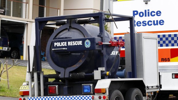 Police raid a house in Marion Place, Belmont North, near Newcastle.
