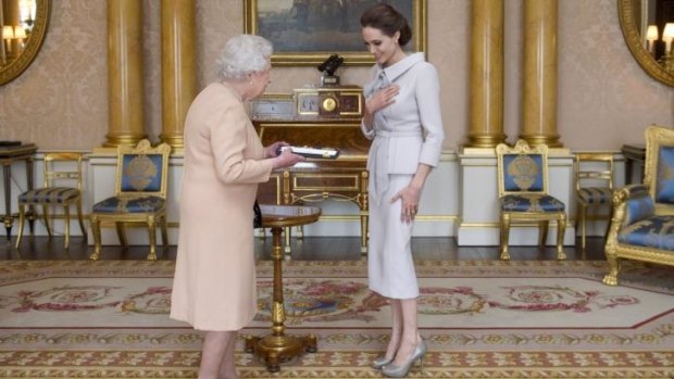 Jolie received the honorary damehood for services to UK foreign policy and the campaign to end sexual violence in war zones.