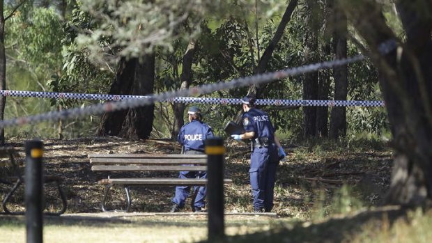 NSW police search the crime scene.
