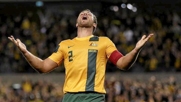 Lucas Neill celebrates a goal against Jordan in Melbourne.