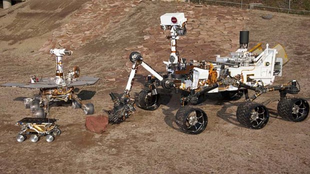 Three Generations of Rovers are pictured in the  Mars Test Yard at NASA's Jet Propulsion Laboratory, California.