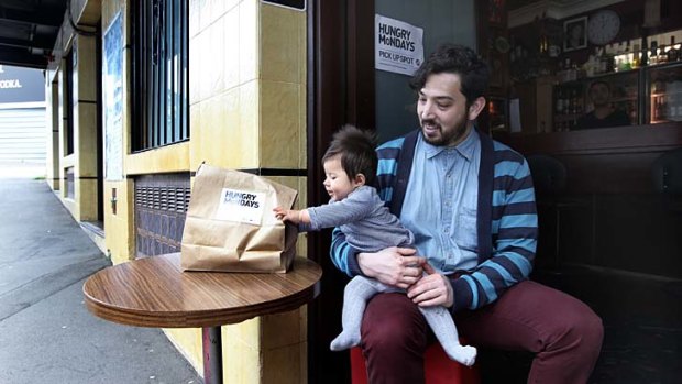 In great demand ... Omar Andrade, pictured with daughter Eva, has started Hungry Mondays, a business selling home-cooked meals to time-poor workers.