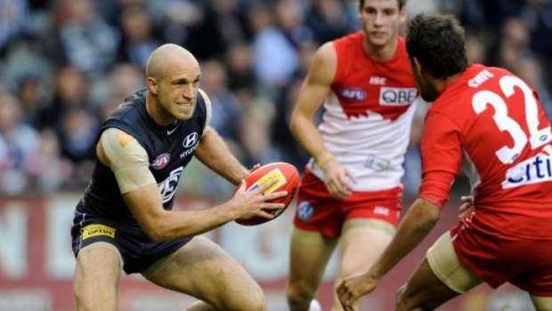 Big shoes: Chris Judd's career includes stellar performances against Sydney in 2010 and 2011.