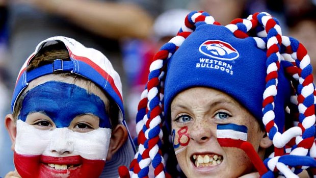 Happy Western Bulldogs supporters Nathan Darbu and Jackson Kelly.