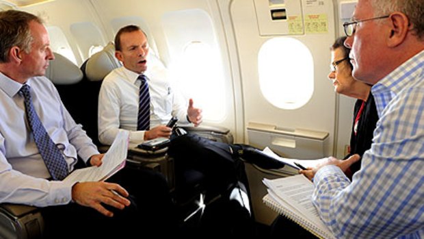 Tony Abbott talks to The Age’s Paul Ramadge (left), Michelle Grattan and Michael Gordon.