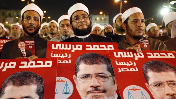 Muslim scholars in Egypt listen to Muslim Brotherhood presidential candidate Mohammed Mursi during a campaign rally in Cairo.