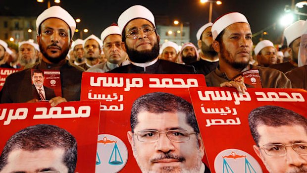 Muslim scholars in Egypt listen to Muslim Brotherhood presidential candidate Mohammed Mursi during a campaign rally in Cairo.