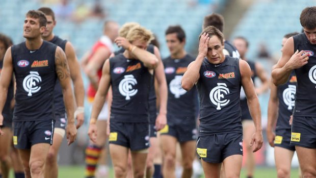Poor form: Carlton players trudge off after losing twice in Adelaide yesterday.